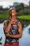 Portrait of handsome man posing with hand under chin. African American athletic person with a tank top shirt