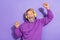 Portrait of handsome retired positive man purple hoodie headphones shout yes eyes closed hands up isolated on violet