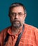 Portrait of handsome senior photographer looking at camera