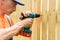 Portrait of a handyman, concentrating at work with a screwdriver