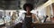 Portrait of happy african american female cafe worker looking at the camera and smiling