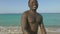 Portrait happy african american man showing victory sign to two fingers on sea beach. Face smiling african american man