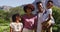 Portrait of happy african american parents, daughter and son standing outdoors