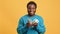 Portrait of happy African American young man counting money and good salary or success in business