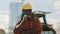 Portrait of happy african farmer in front of tractor and silo system