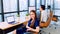 Portrait of happy Asian businesswoman sit and smile in startup company office, business coworker working on desktop computer