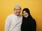 Portrait of happy Asian muslim couple smiling and laughing, husband and wife hugging full of love, family