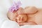 Portrait happy baby girl new born sleeping with purple flower