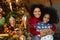 Portrait of happy biracial mom and daughter celebrate Christmas