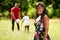 Portrait Of Happy Black Woman Looking At Camera With Family