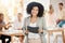 Portrait of a happy black woman smile in a team planning meeting at work. Business woman in an office with staff as they