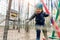 Portrait happy brave courage little toddler child boy wear safety equipment helmet enjoy passing obstacle course forest