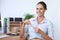 Portrait of happy business woman with pen at desk, confidence or career at accounting agency. Financial advisor