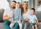 Portrait of a happy caucasian family looking relaxed while bonding on a sofa together. Adorable little boys chilling on