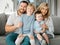 Portrait of a happy caucasian family looking relaxed while bonding on a sofa together. Adorable little boys chilling on