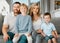 Portrait of a happy caucasian family looking relaxed while bonding on a sofa together. Adorable little boys chilling on