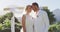 Portrait of happy caucasian newly wed couple, standing at altar outdoors