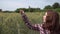 Portrait of a happy caucasian woman in the field of wheat close up