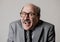 Portrait of happy and cheerful senior mature 60s business man smiling wearing dressing formal necktie looking cheerful and excited