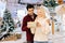 Portrait of happy cheerfully blonde woman receiving gift box from loving husband standing in hall of celebrate shopping