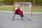 Portrait of happy child play hockey outside