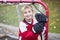 Portrait of happy child play hockey outside