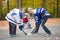 Portrait of happy child play hockey outside with mother