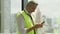 Portrait of happy civil engineer foreman with safety vest