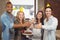 Portrait of happy colleagues toasting with champagne