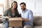 Portrait of happy couple clients unpack postal box