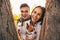 Portrait of happy couple with dogs outdoors in autumn park