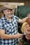 Portrait of a happy cowboy with riding tack in feed store