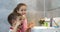 Portrait happy cute young children brushing teeth in bathroom and smiling. Children daily healthcare routine. Caucasian