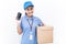 Portrait of happy delivery asian woman her hands holding cardboard box