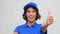 Portrait of happy delivery woman showing thumbs up