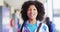 Portrait of happy diverse schoolchildren at locker in school