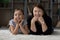 Portrait of happy elderly grandmother and granddaughter relaxing