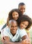 Portrait of Happy Family Piled Up In Park