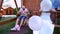 Portrait of a happy family on a summer vacation, Family riding a seesaw, merry holiday for dad mom and baby