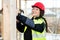 Portrait Of Happy Female Carpenter Hammering Wood