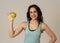Portrait of happy fitness young latin woman with apple after workout training