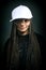 Portrait of happy girl with dreadlocks in cap