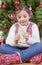 Portrait of happy girl eating turron