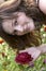 Portrait of a happy girl holding a rose