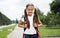 Portrait of happy girl with school bag standing outdoor. Little happy school girl going to school, back to school, education