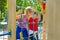 Portrait Of happy girlfriends playing outdoors on playground