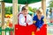 Portrait Of happy girlfriends playing outdoors on playground