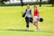 Portrait of happy golfing couple