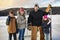 portrait of happy hockey family on a lake