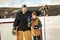 portrait of happy hockey player with his father on a lake